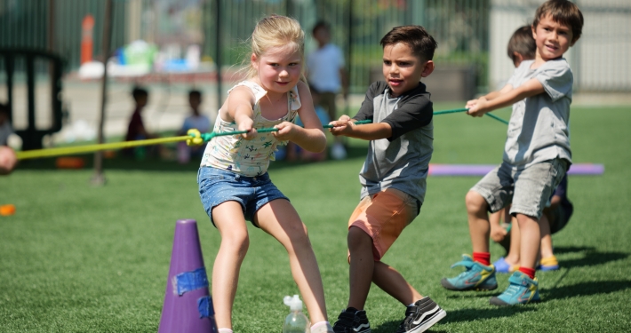 Children play of tug of war